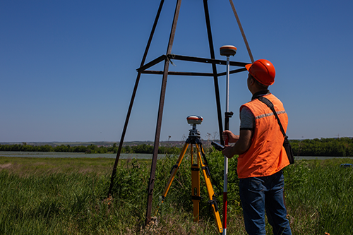 surveyor in field with remote gps 